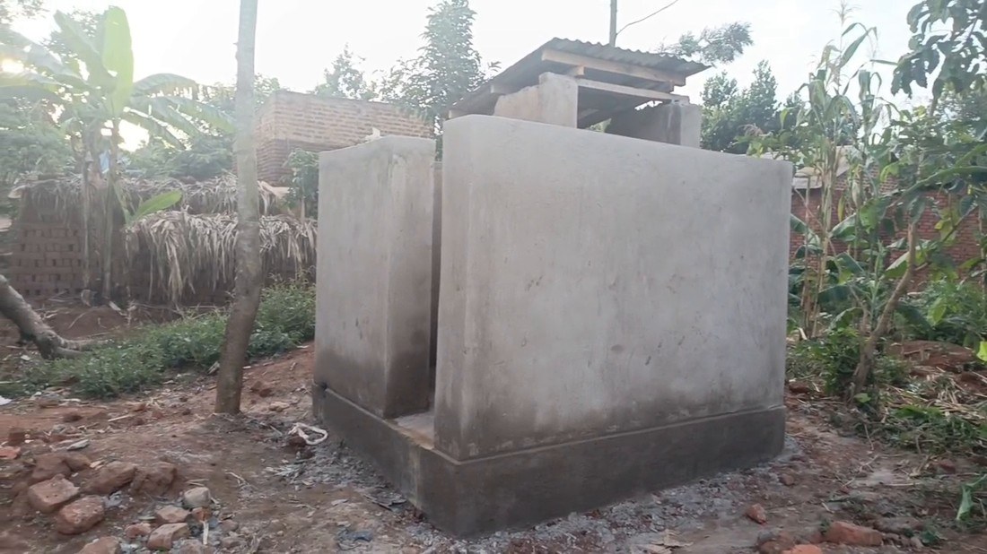 The new latrine: a plastered block on its own concrete slab