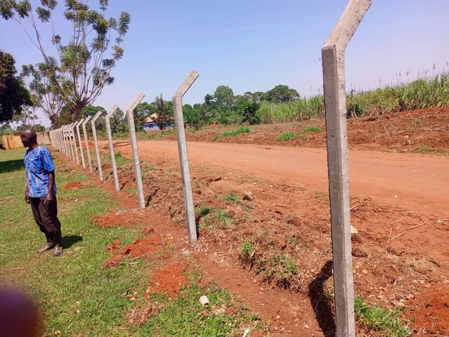 The new fence going up around the 4.2-acre Great Love Junior Academy compound