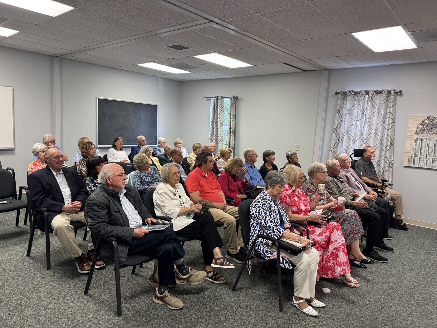 Members of the Empty Nesters class seated and listening