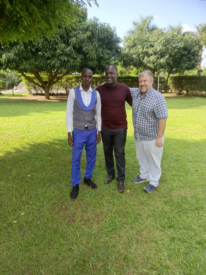 Pastor Isaac, Enock Nkulanga and Pastor Hundley Harkleroad under the mango trees in Kampala