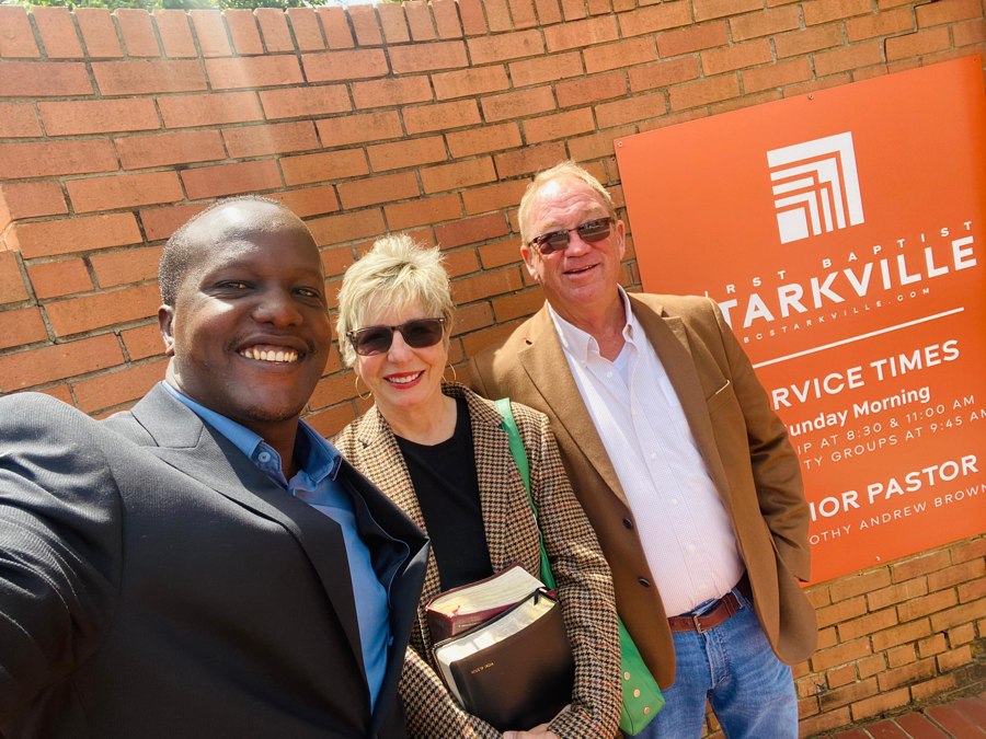 Enock Nkulanga with Vicki and Max Alston outside First Baptist Starkville